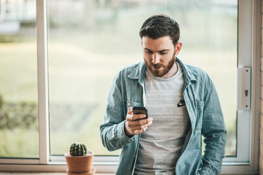 Man reading text message