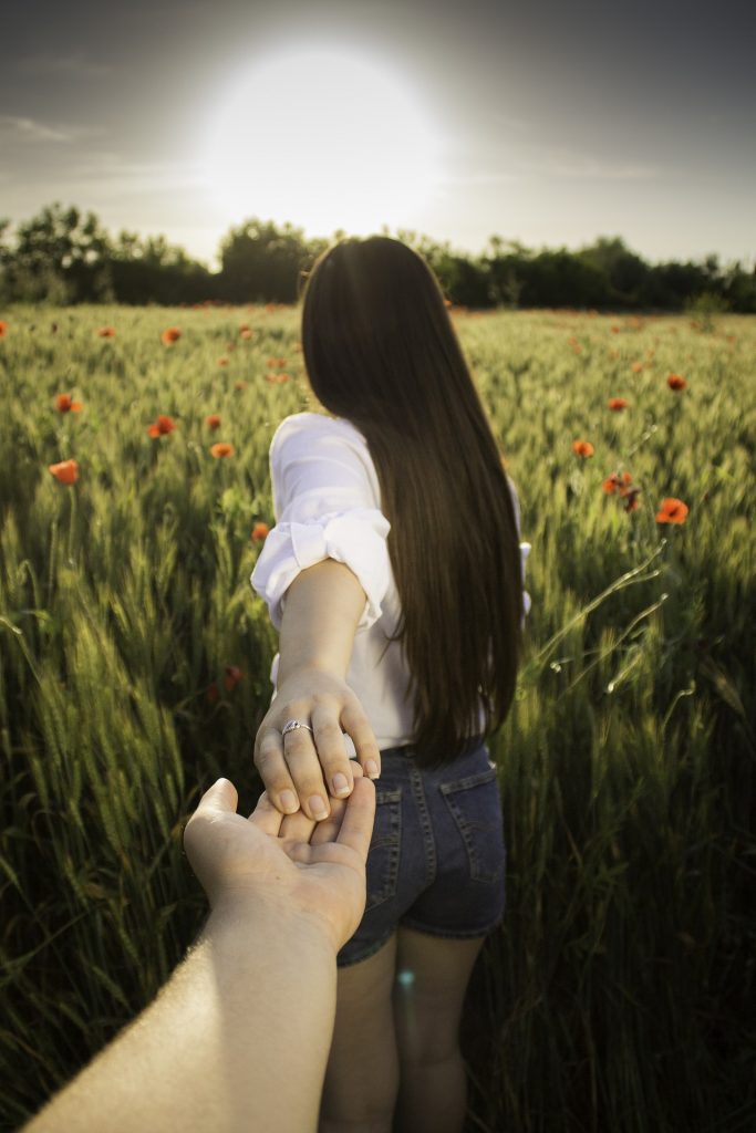 Girl taking a walk in a field