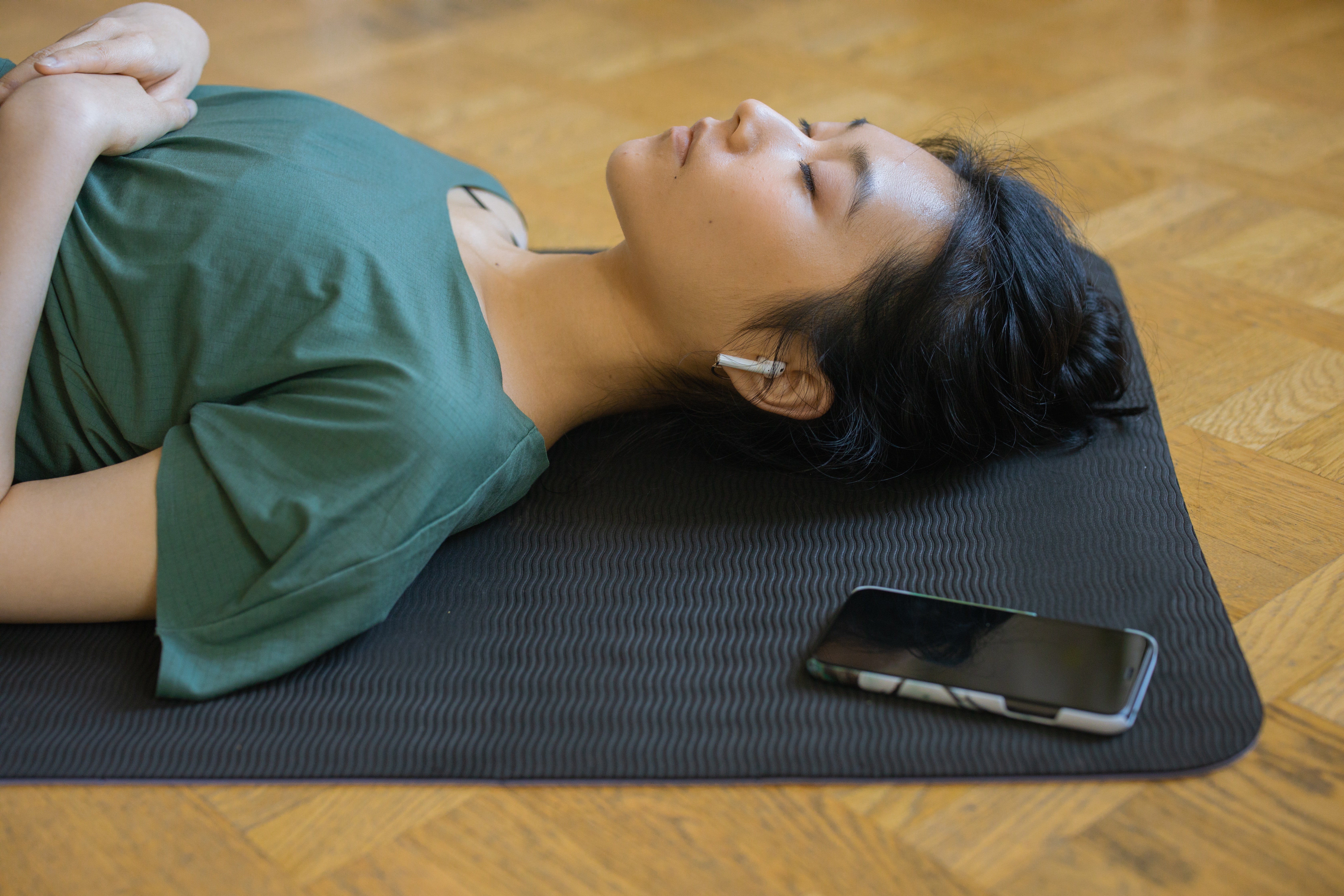 Girl laying down listening to a guided relaxamation