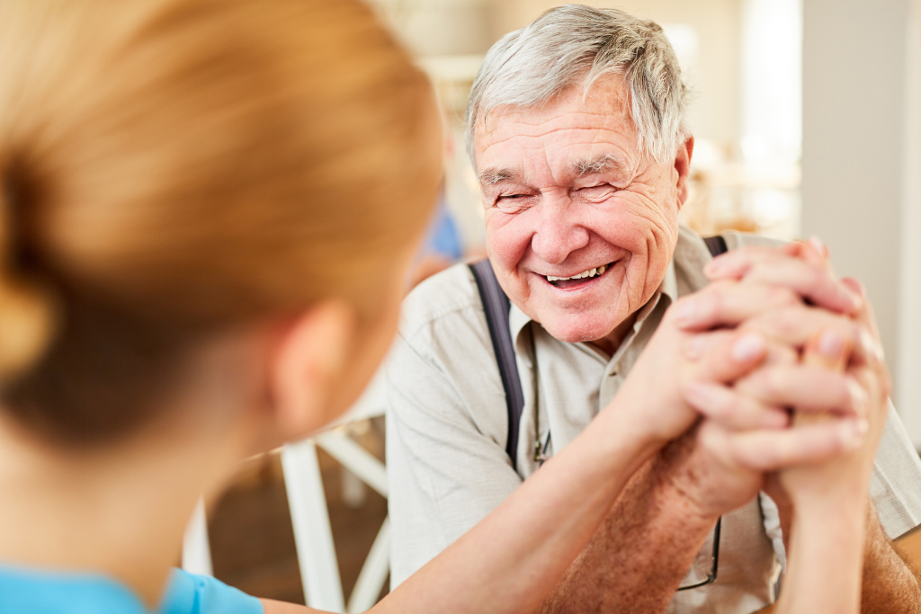 Old man talking to nurse